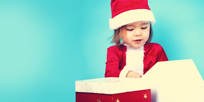 Little girl opening a present