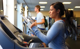 woman running on treadmill