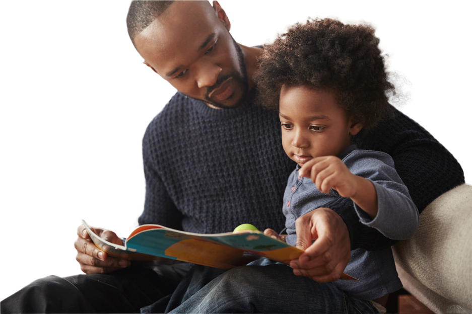 AdobeStock_205898981.jpeg (Father And Young Son Reading Book Together At...